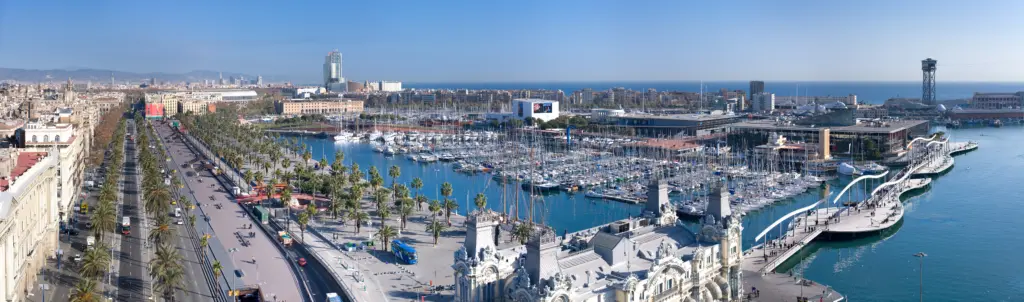 An aerial panoramic view from the the Columbus Monument (Monument a Colom in Catalan) across Port Vell in Barcelona, Spain